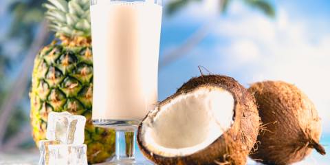 A cold glass of pineapple coconut smoothie