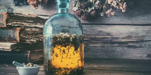 an herb and honey elixir in an old-fashioned bottle