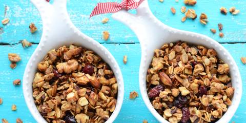 Two cups filled with granola. 