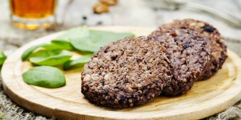 Prepared Chipotle Black Bean and Rice Burgers on a cutting board.
