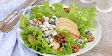 a green salad with pears, gorgonzola, and nuts