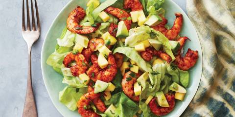 A plate of shrimp and mango salad