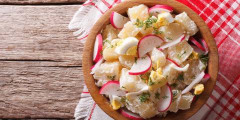 Fresh Spring Potato Salad in a wooden bowl ready to serve.