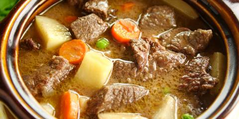 Rich hearty oven beef stew simmering and ready to serve.