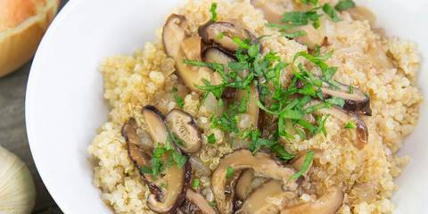 a bowl of mushrooms over quinoa