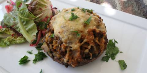 Baked stuffed mushrooms with cheese.
