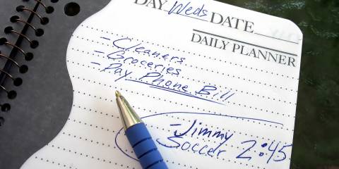 A daily planner filled with chores and notes about kids