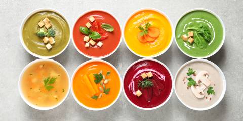 bowls of various creamy soups