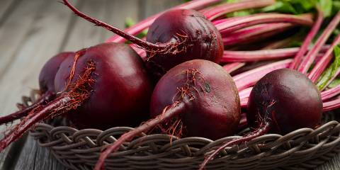 Fresh beets on a wooden table.
