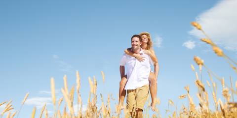 happy romantic couple in a field