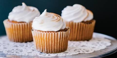 A plate of delicious lemon curd cupcakes with chickpea meringue