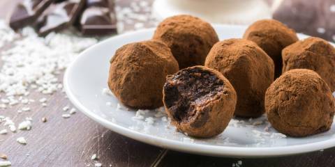 A plate of dark chocolate truffles