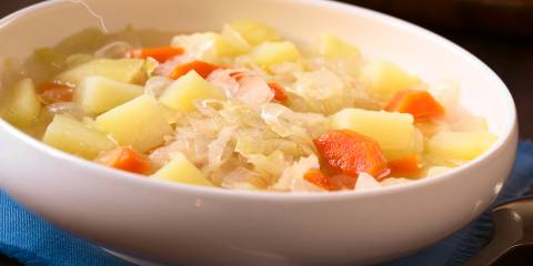 A bowl of vegetarian irish stew with cabbage and potatoes