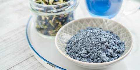 blue matcha powder, dried butterfly pea, and a drink