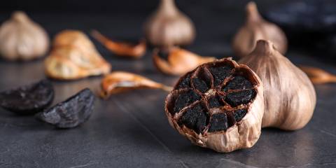 cloves of aged black garlic