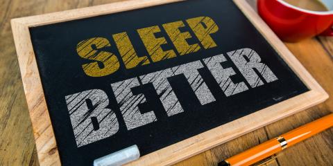 Small chalkboard with the message Sleep Better written in chalk on it.