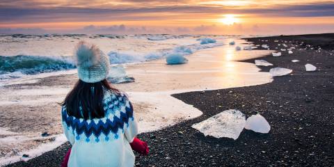 a healthy woman looking out at the cold sea