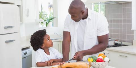 a father and son preparing a healthy meal in the kitchen