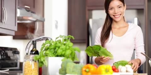 A woman with nutritious foods on her counter