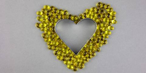 vitamin d3 supplements arranged into a heart shape