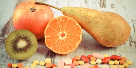 fresh fruits and vitamin tablets