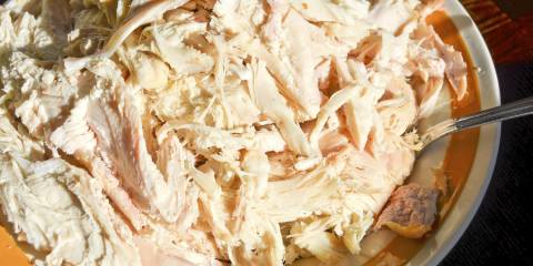 Leftover turkey meat, shredded on a dinner plate