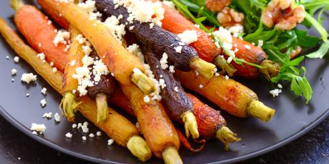 braised baby carrots and greens with cheese and nuts