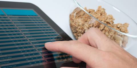 a man reading a nutrition chart to learn about muesli
