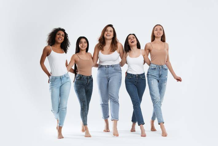 a group of happy, healthy women with different body types