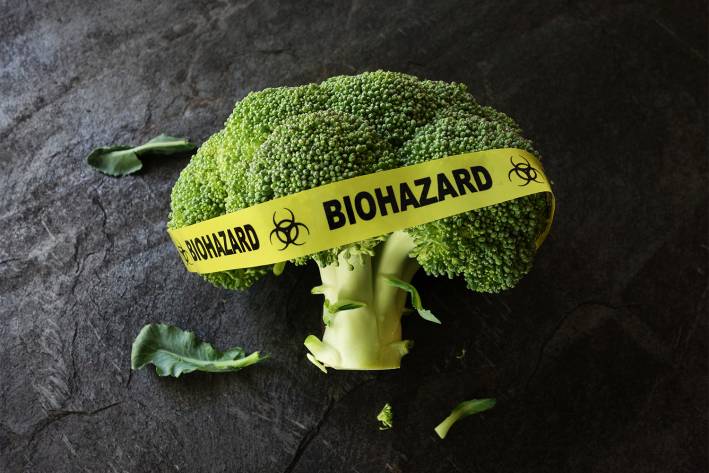 A broccoli floret wrapped in biohazard tape