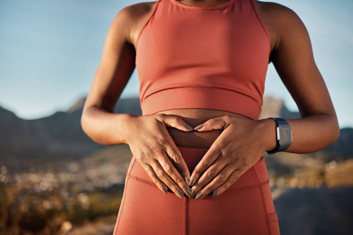 a runner indicating she has a healthy gut