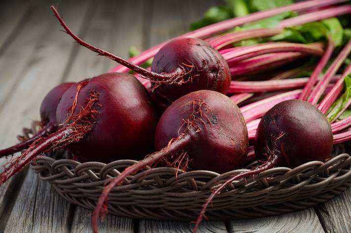 Fresh beets on a wooden table.