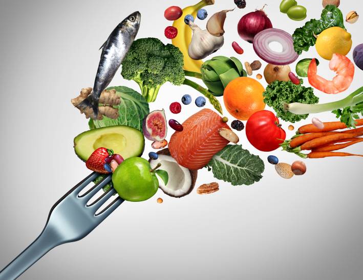 GLP-1 Medications and Nutrition Illustration of a fork with many healthy foods bursting from it.