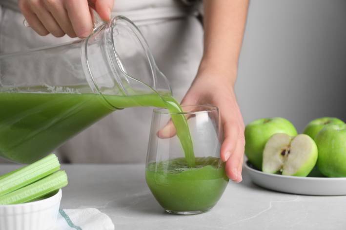 Celery juice being poured 