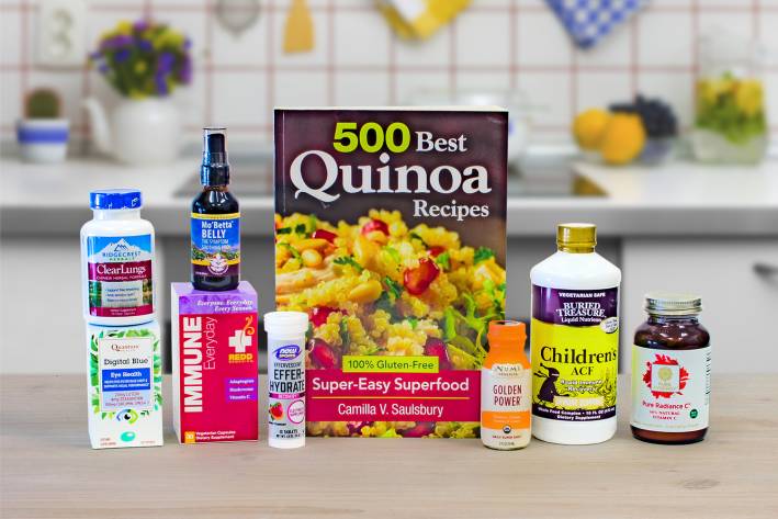 a selection of all-natural supplements and a book of gluten-free quinoa recipes