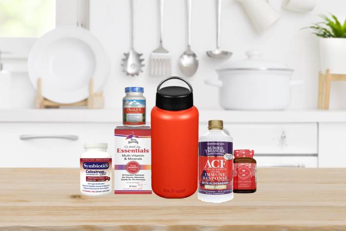 a selection of all-natural supplements and a metal water bottle