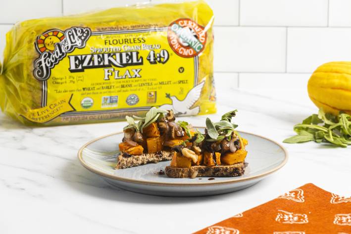 autumn bruschetta on a plate and Food for Life Ezekiel 4:9 Flax bread in the background