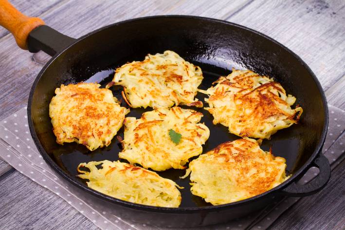 Sweet potato Latkes in frying pan.