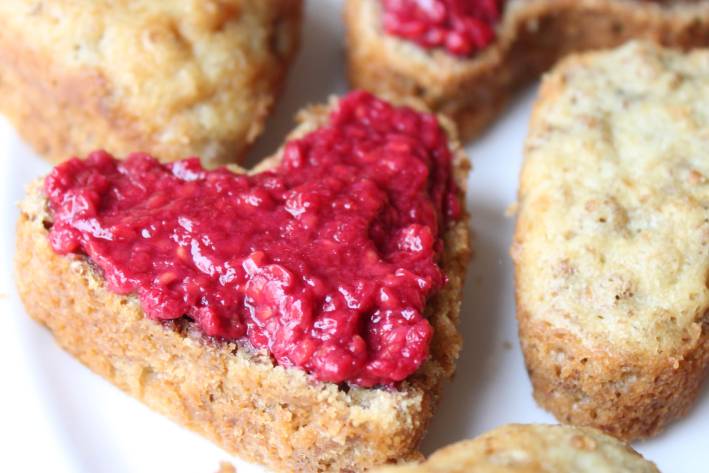heart-shaped bran muffins with raspberry on top