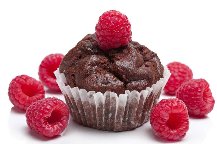 a chocolate muffin with a raspberry on top