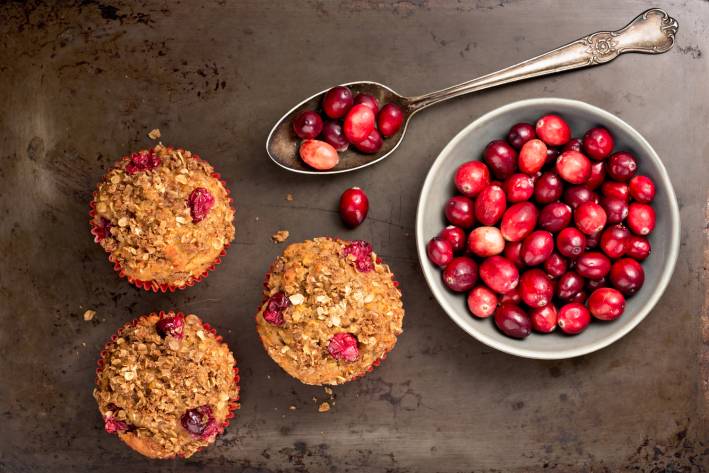 oat muffins with cranberries on a pan