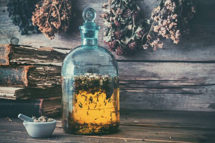 an herb and honey elixir in an old-fashioned bottle