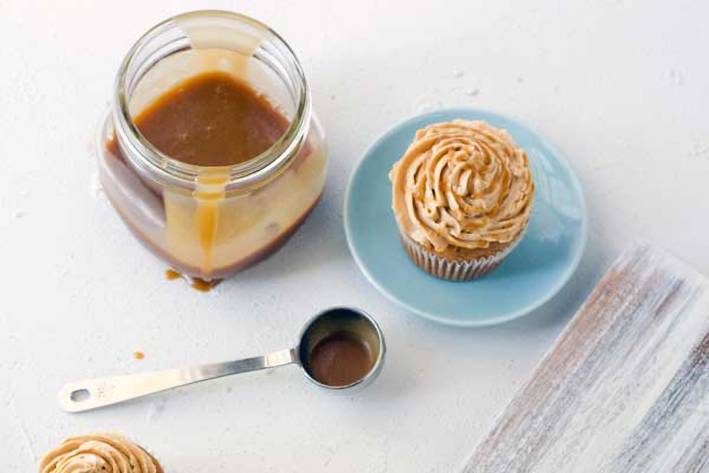 a gluten-free cupcake and a jar of caramel