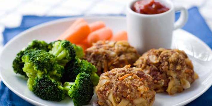 Mac and cheese meatballs with broccoli and carrots.