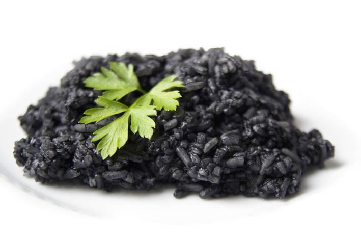 boiled black rice with herbs on top