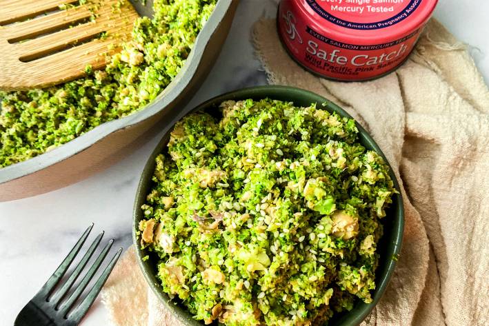 a bowl of broccoli and salmon