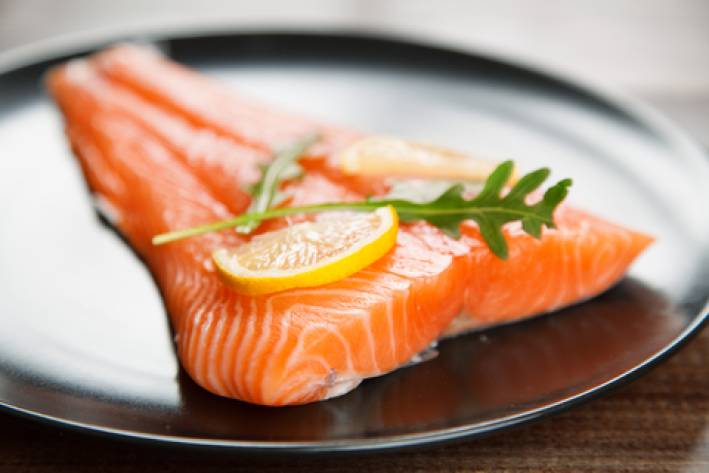 Raw salmon fish fillet on plate