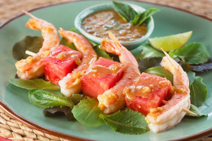 shrimp and cubes of watermelon plated nicely