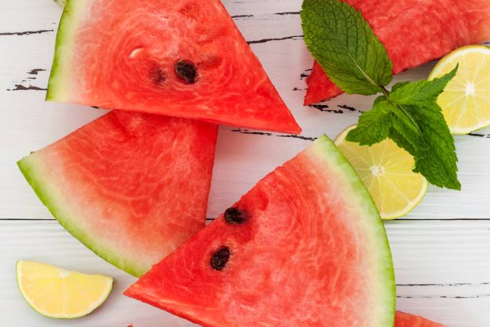 slices of watermelon and lemon with mint leaves