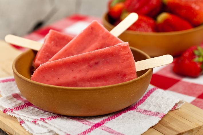 a bowl of frozen strawberry pops
